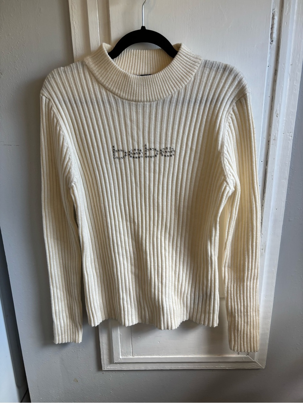 bebe Cream Ribbed Turtleneck Sweater with Embellished Logo